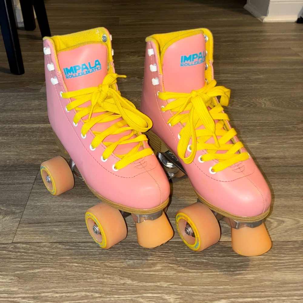 Pink Roller Skates with Yellow Laces